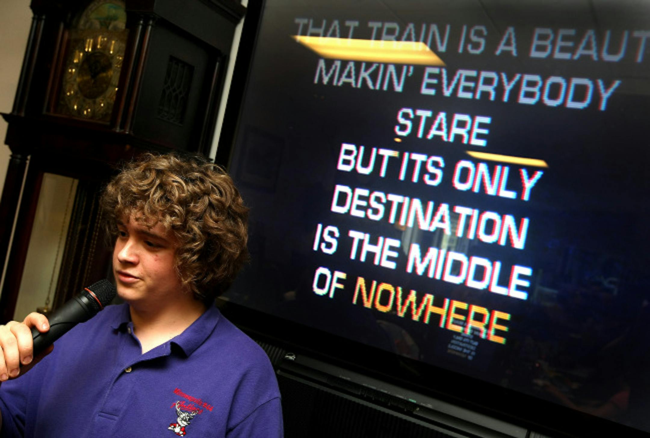Sean Murray, of Osseo, takes a turn in the spotlight during the Kids Karaoke competition at the Elks Lodge in Brooklyn Park.