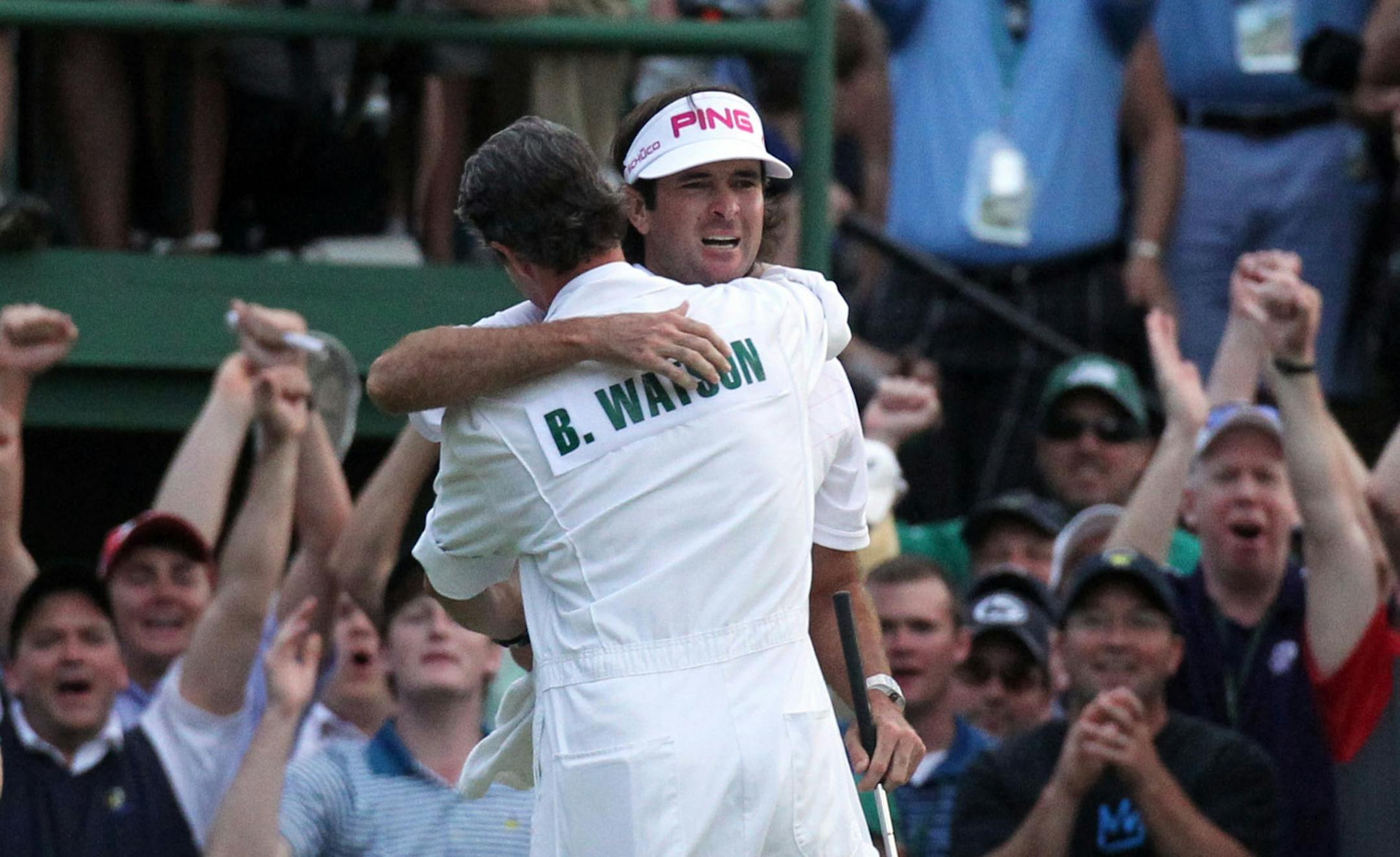 Bubba Watson is congratulated by caddie Ted Scott after winning the Masters in a sudden death playoff last year.
