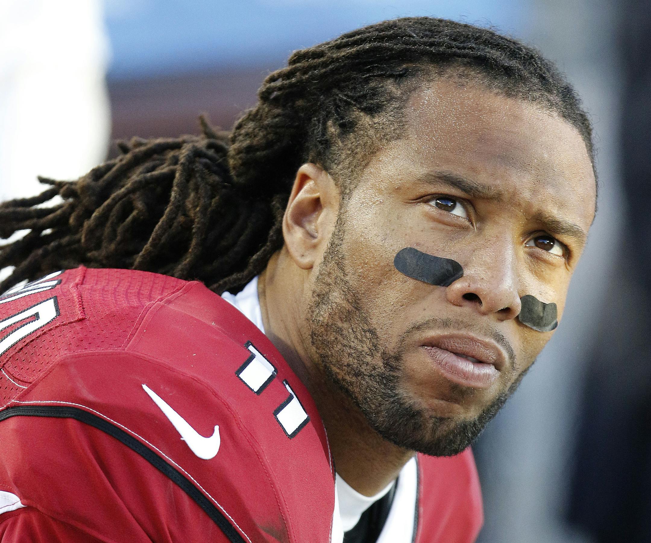 Arizona Cardinals wide receiver Larry Fitzgerald (11) sits on the bench during the fourth quarter of an NFL football game against the San Francisco 49ers in Santa Clara, Calif., Sunday, Dec. 28, 2014. (AP Photo/Tony Avelar) ORG XMIT: FXN