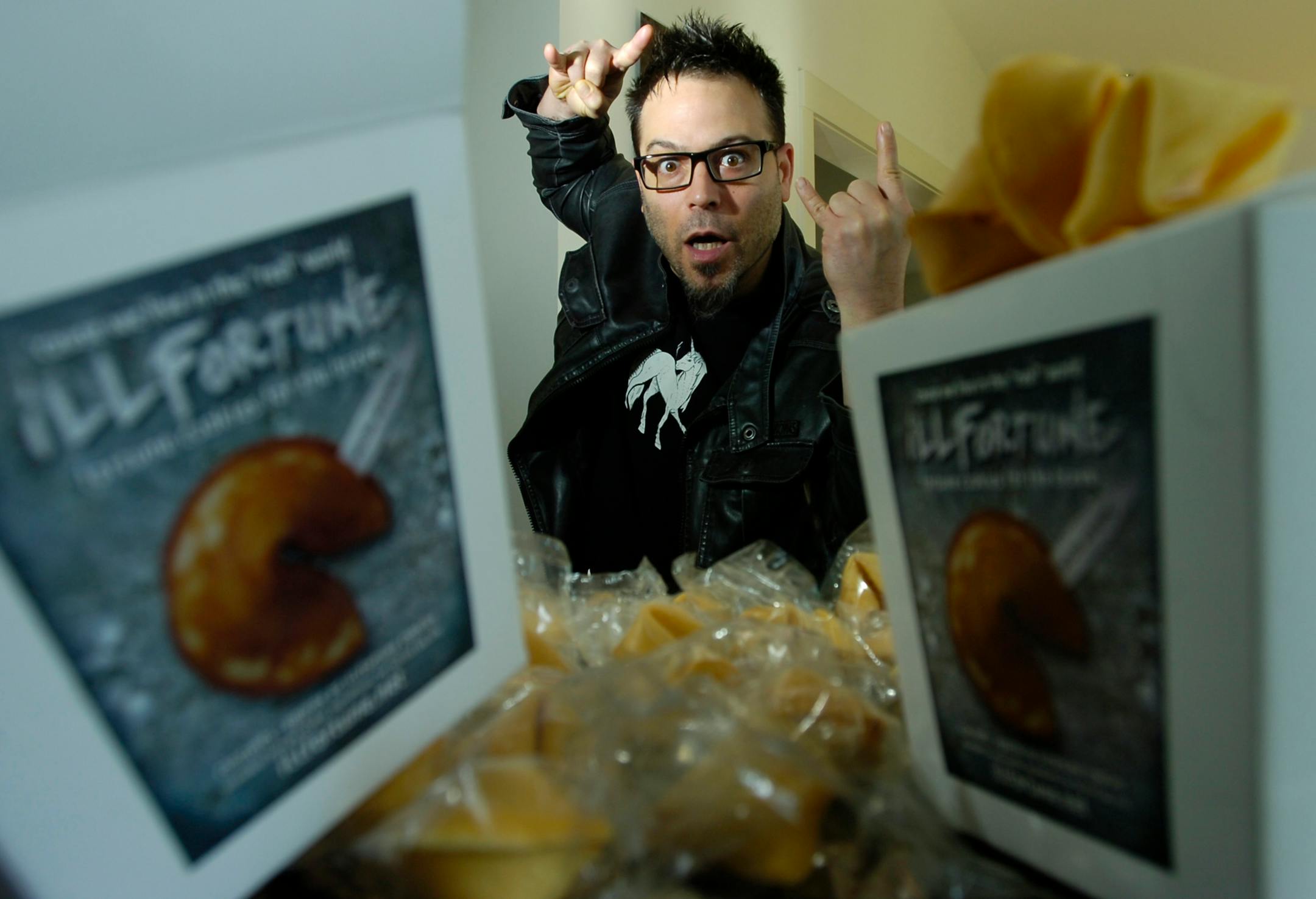 David Fenton strikes a slightly maniacal pose to go along with his "Ill Fortune Cookies" in San Rafael, California, February 14, 2012. "Ill Fortune" Cookies feature humorous, irreverent and offbeat messages that are not to be found in any Chinese restaurant. (Kristopher Skinner/Contra Costa Times/MCT)
