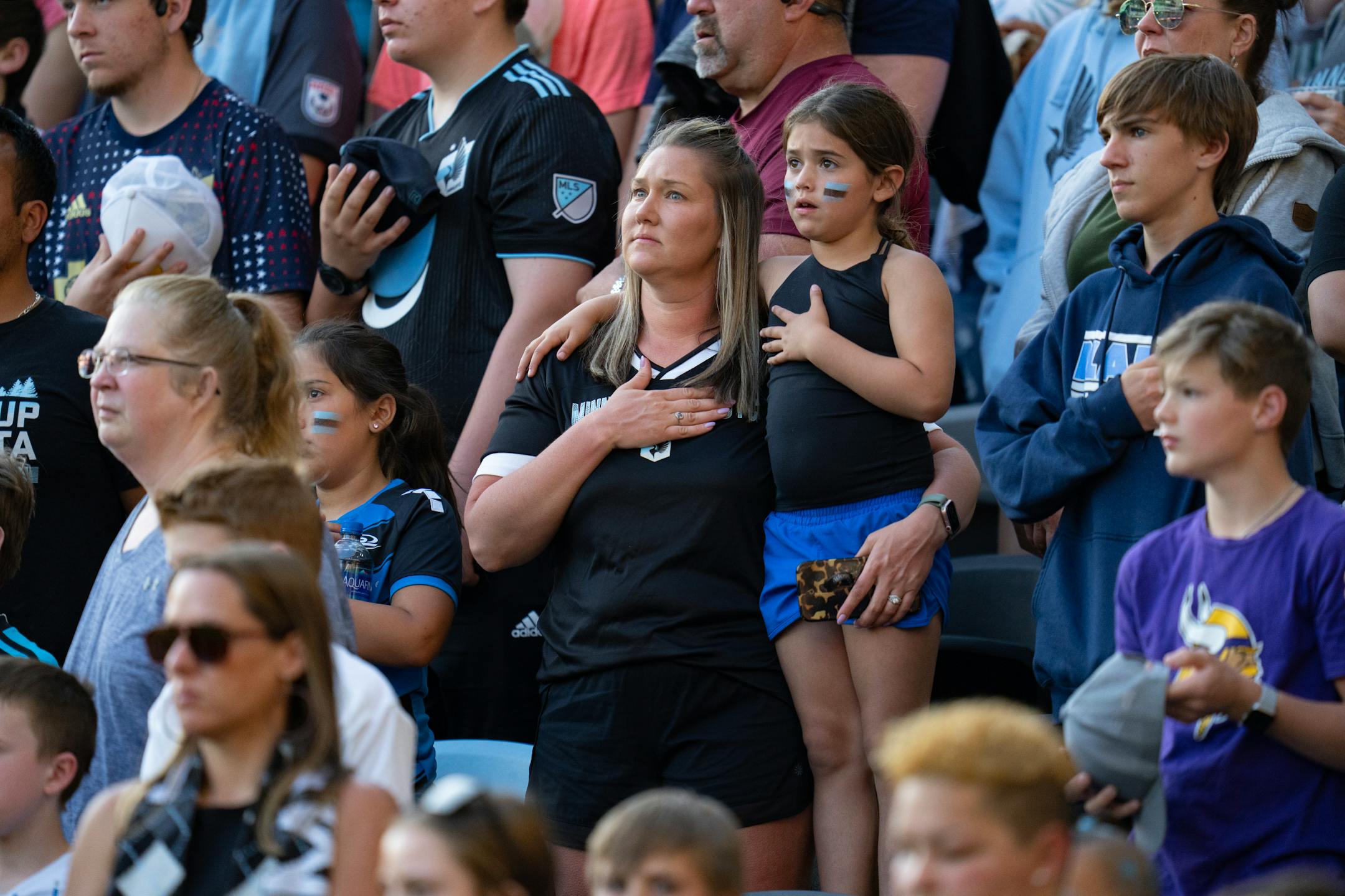 Minnesota United fans stand for the "The Star-Spangled Banner" before the match against Real Salt Lake.