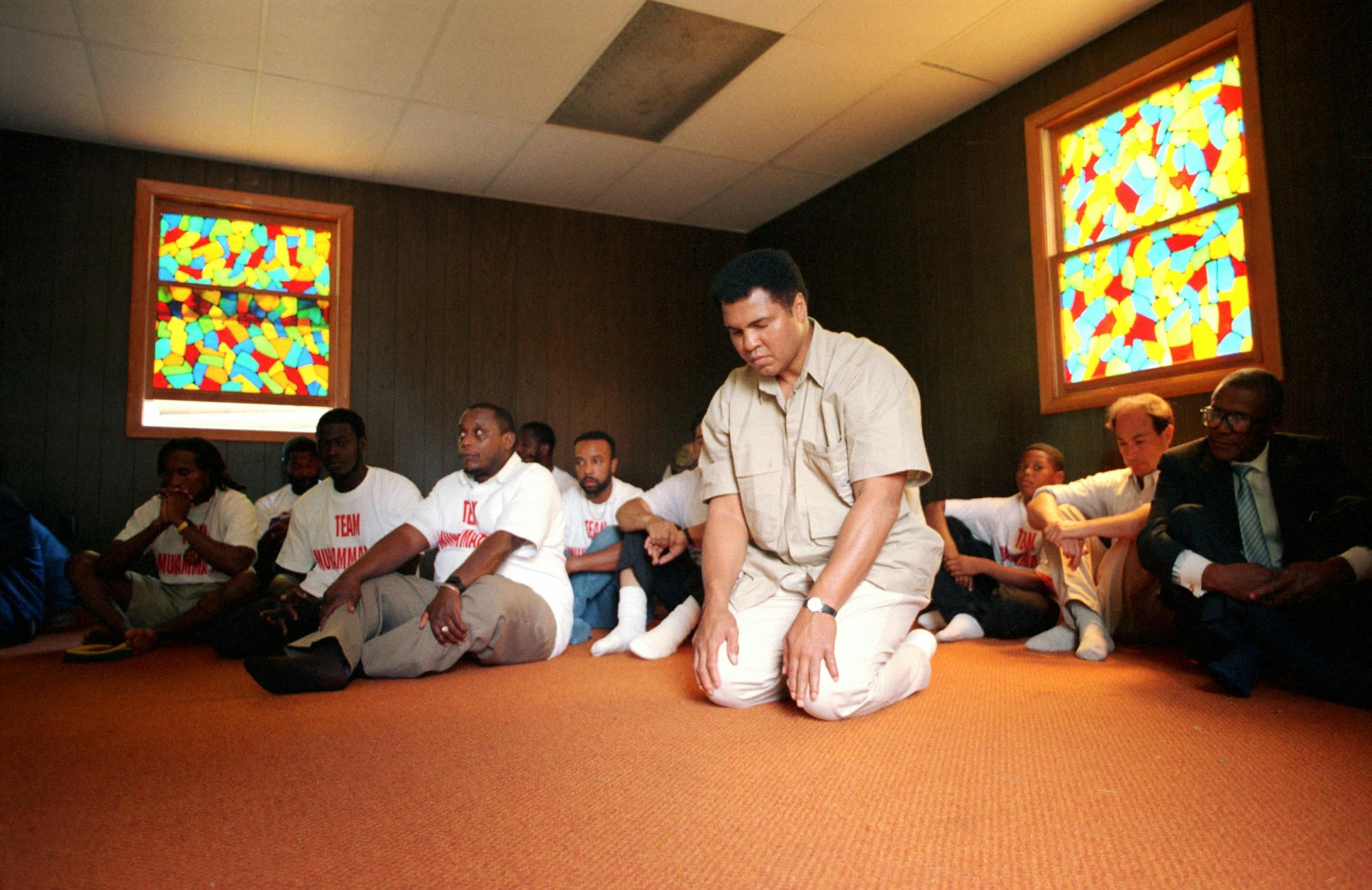 Former world heavyweight boxing champion Muhammad Ali prays in the mosque he built at his former training camp in Deer Lake, Pa., June 5, 1991.
