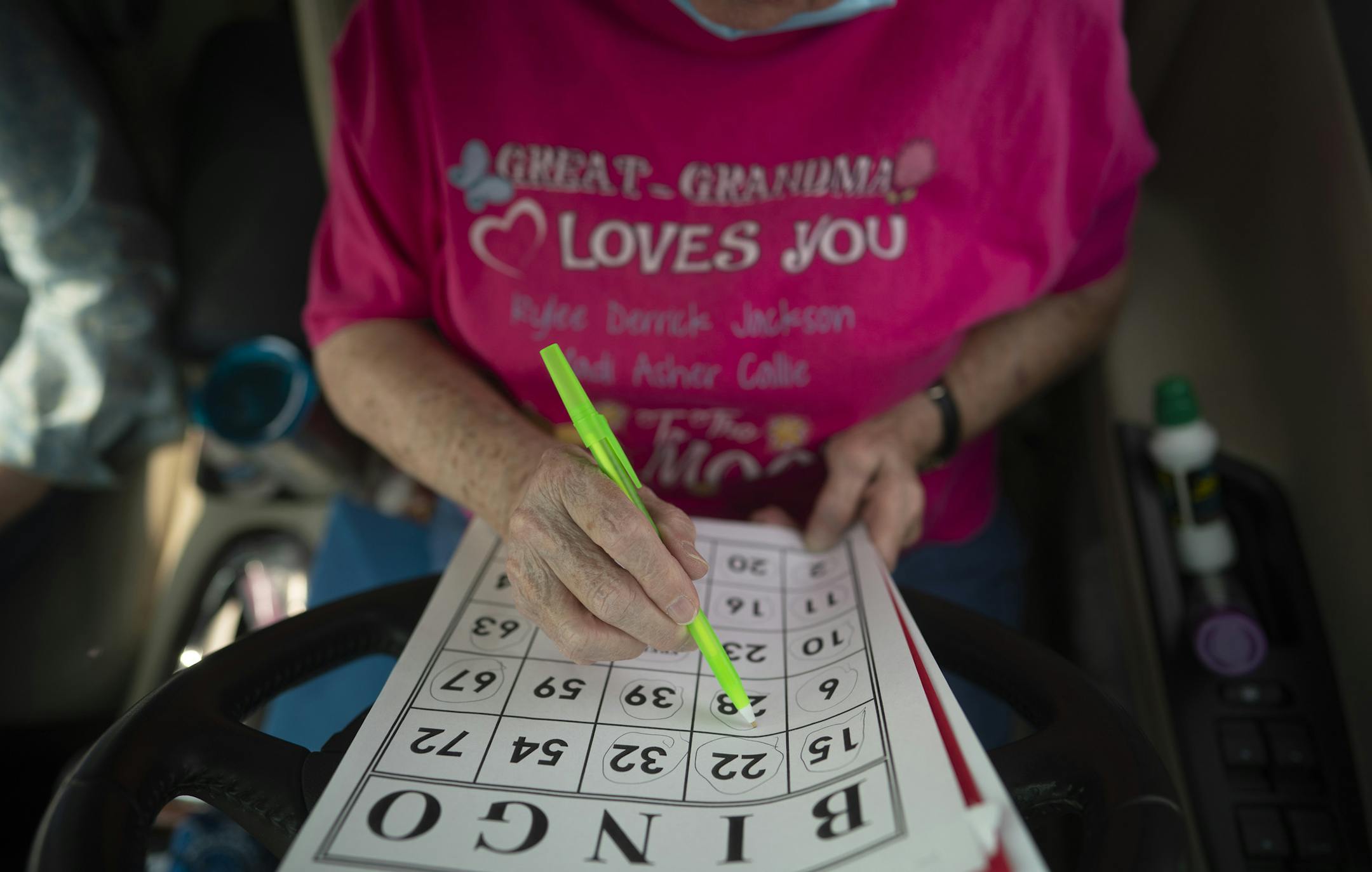 Anna Griep drew a circle around the number on her card when I-28 was called. ] JEFF WHEELER • jeff.wheeler@startribune.com Coon Rapids seniors looking to get out of their houses for some fun have been heading to the Coon Rapids Soccer Complex parking lot to play bingo – in their cars. This week's game drew about 30 cars on Monday afternoon, September 21, 2020.