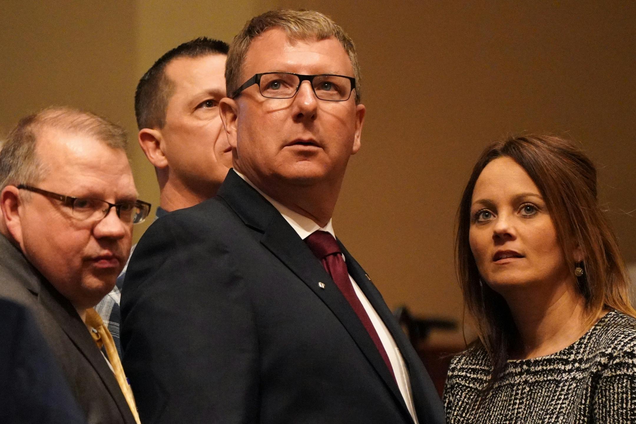Rep. Paul Novotny, R-Elk River, stood on the House floor with his wife before being sworn in at the start of the legislative session Tuesday.