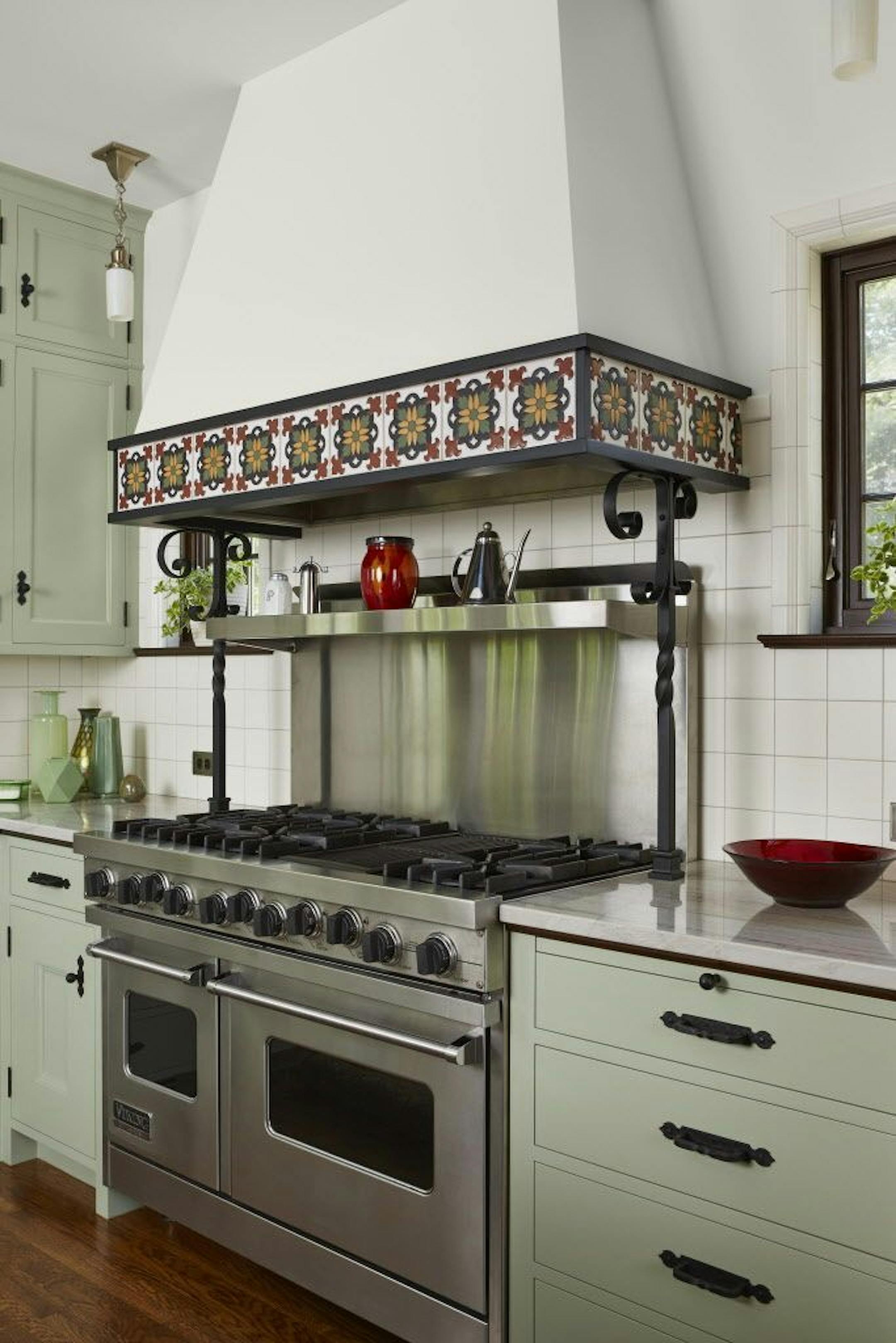 Tile and wrought-iron details carry out the Mediterranean theme.