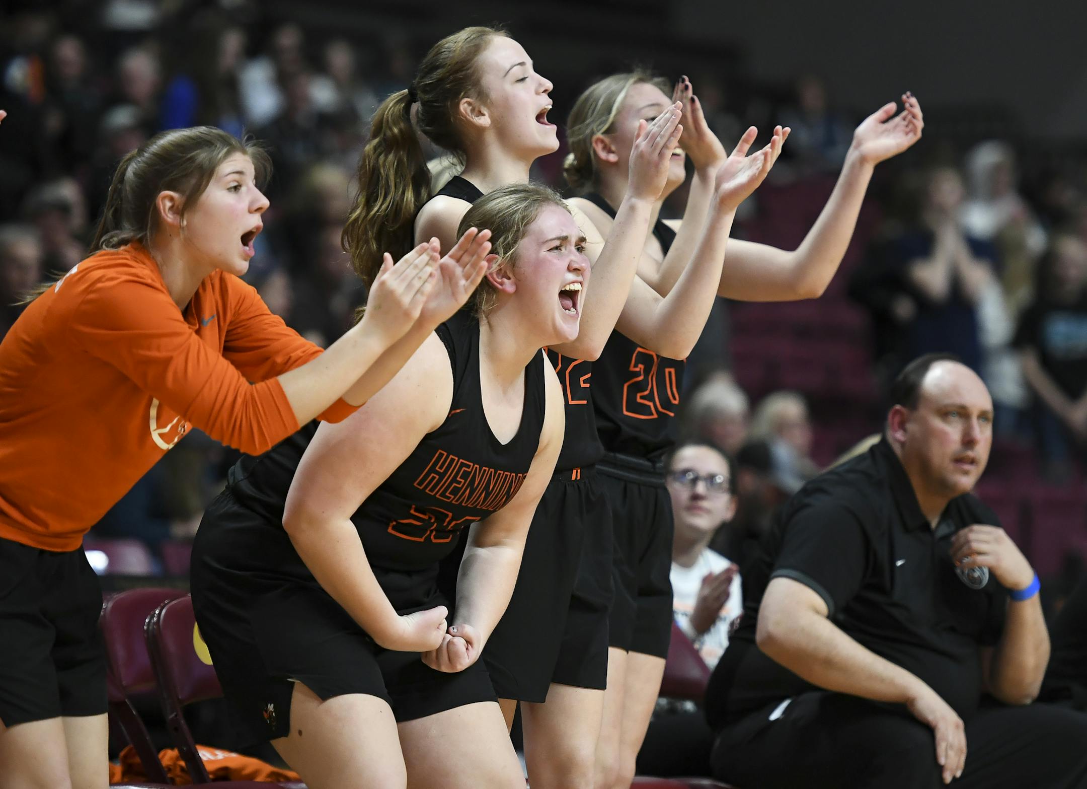 The Henning bench cheered during a victory over Fillmore Central in the Class 1A girls' basketball quarterfinals. It was the Hornets' last game.