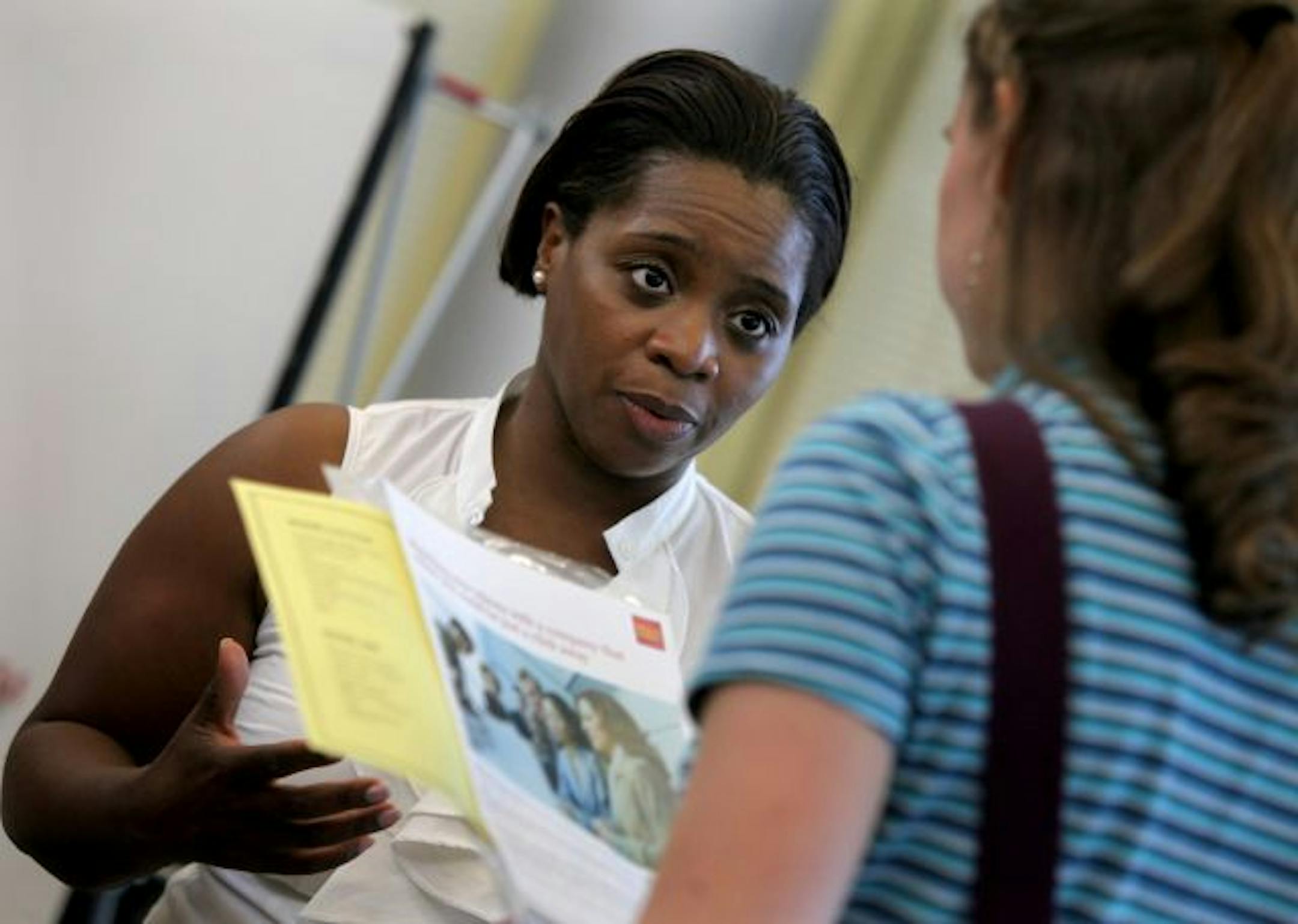 Ursala McNeal, a Wells Fargo branch manager, took questions from job seekers and students at a Rasmussen career fair in Brooklyn Park.