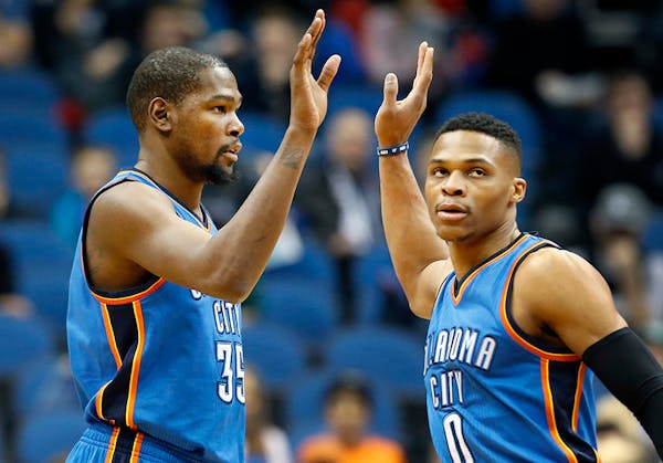 Kevin Durant (35) and Russell Westbrook (0).