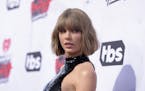 FILE - In this April 3, 2016 file photo, Taylor Swift arrives at the iHeartRadio Music Awards at The Forum in Inglewood, Calif. Swift is donating $1 m