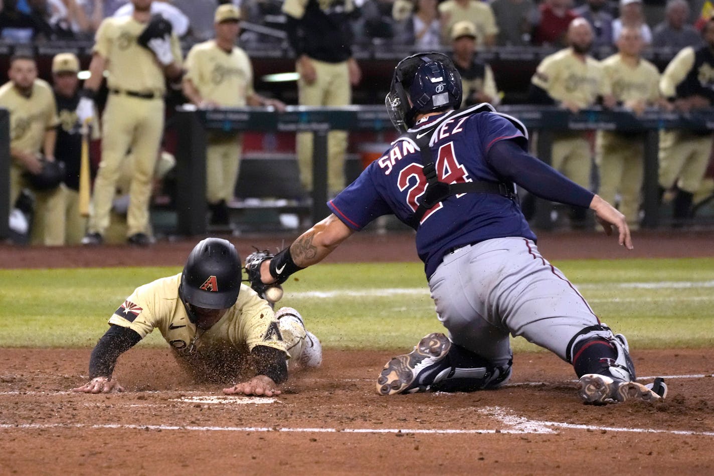 Arizona's Alek Thomas scores as Twins catcher Gary Sanchez tries to make the tag during the fourth inning Friday