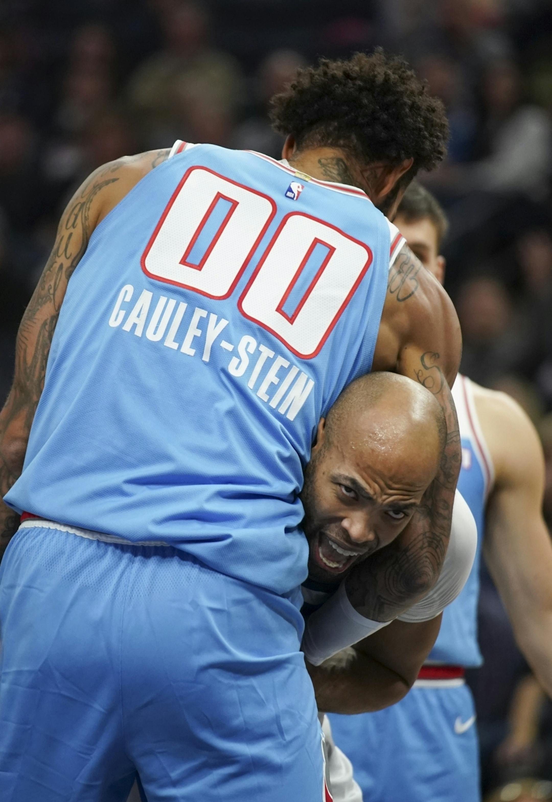 Minnesota Timberwolves forward Taj Gibson (67) appeared to be in a headlock by Sacramento Kings center Willie Cauley-Stein (00) under the net in the first quarter.