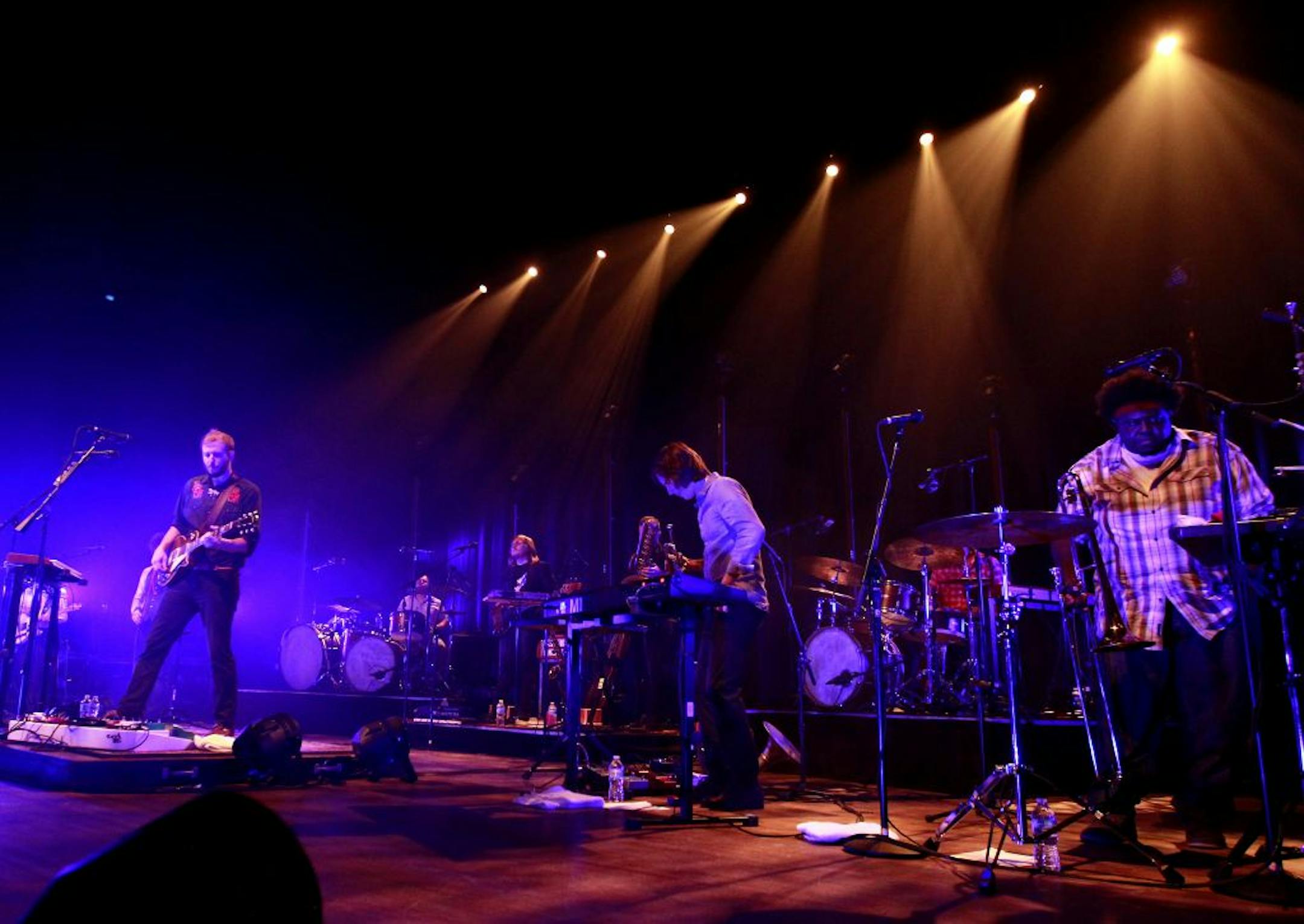 Justin Vernon, left, led a new and impressive nine-man lineup of Bon Iver at the Orpheum Theatre on Tuesday, where he returns Wednesday for another sold-out performance.