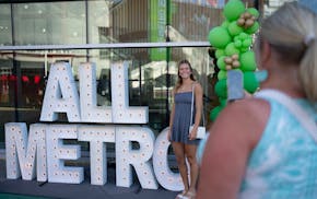 Champlin Park volleyball player Carly Gilk posed for a photo by her mom, Shelley, when they arrived for the AMSA celebration at Target Field.