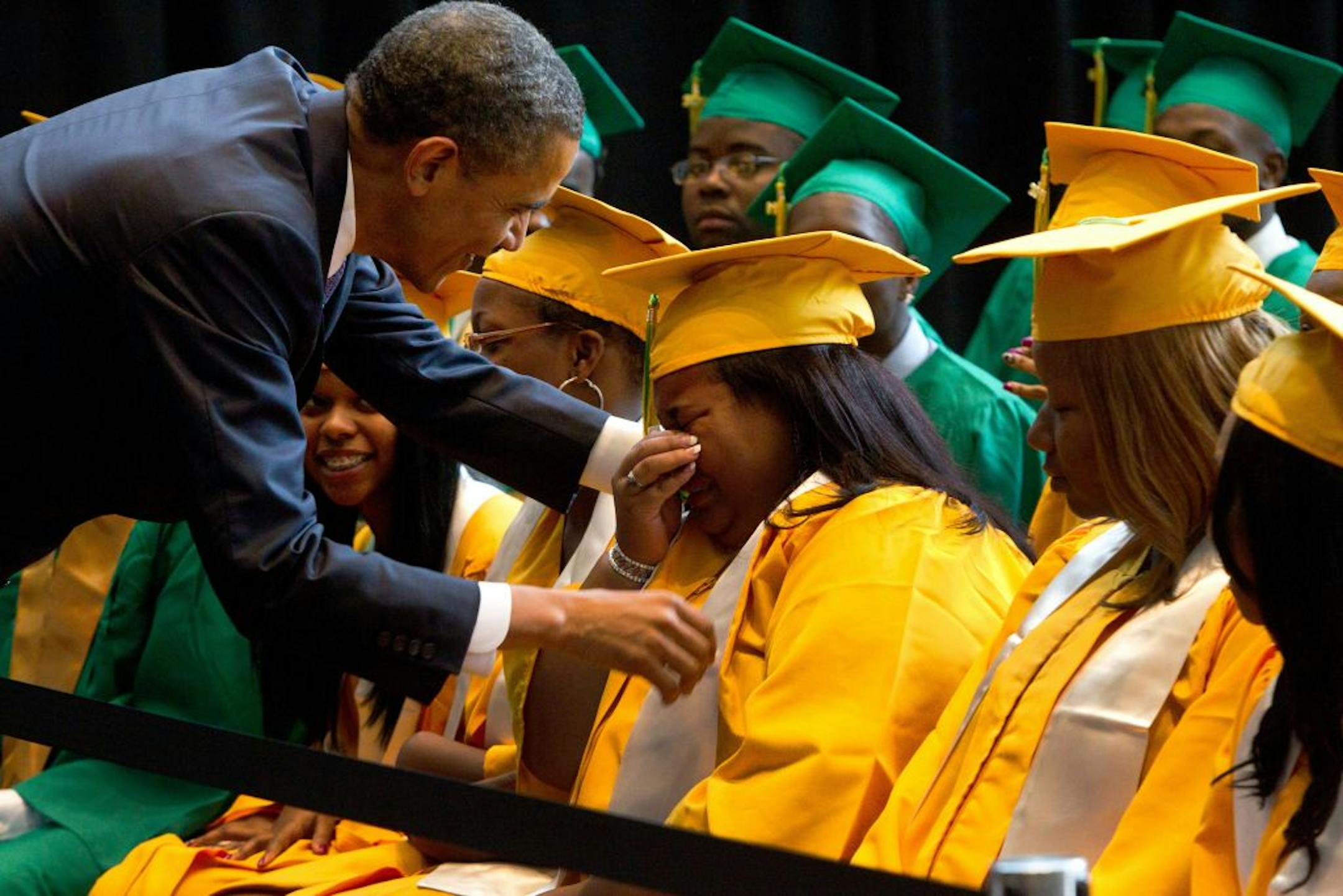 President Obama spoke to an emotional high school senior before delivering the commencement address Monday at Booker T. Washington High School in Memphis. "Whatever you accomplish in your lives, you will have earned it," he said in the speech.
