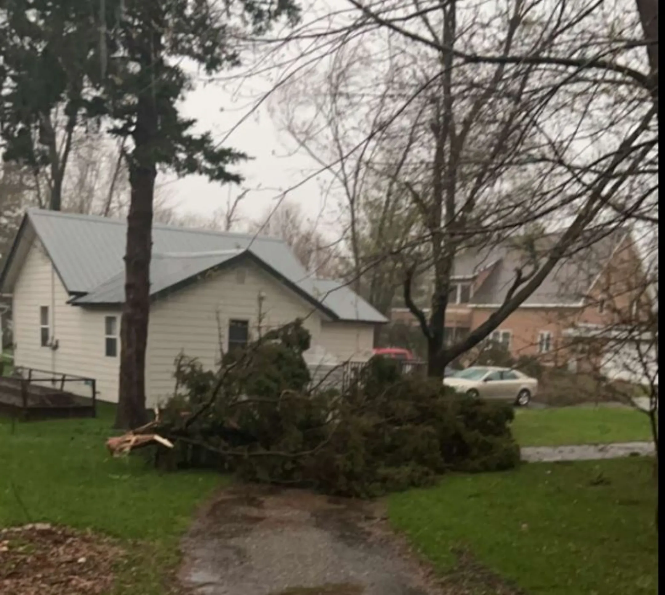 On-duty firefighter killed as severe storms cause damage across western ...