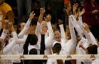 Gophers celebrated their win in three sets over Penn State earlier this month.