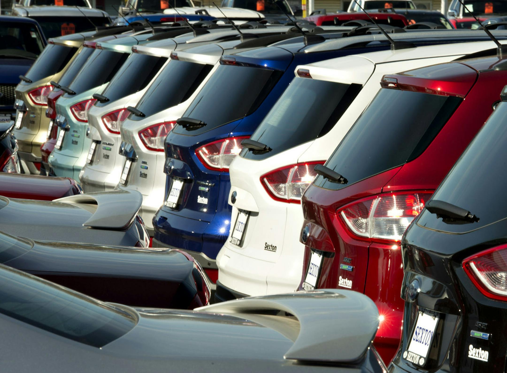 Fordís Escape small SUV has become a boomer magnet since a redesign last year made it more carlike and less rugged-looking. A row of 2013 Escapes is shown in 2012 at a dealership in Moline, Ill. Illustrates AUTOS-BOOMERS (category f) by Keith Naughton © 2013, Bloomberg News. Moved Saturday, Aug. 10, 2013. (MUST CREDIT: Bloomberg News photo by Daniel Acker).