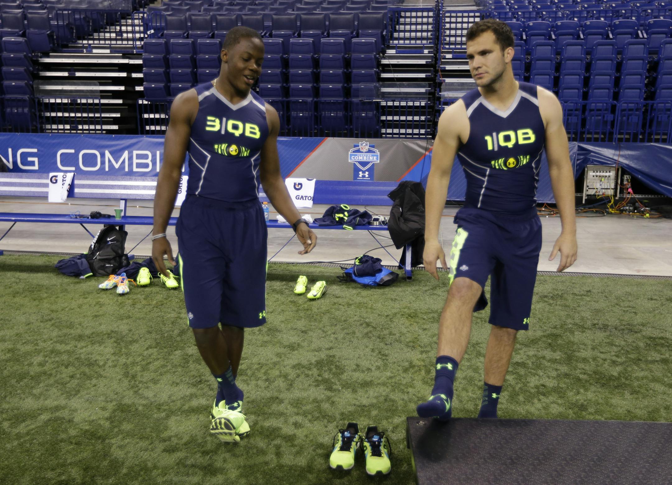 Louisville quarterback Teddy Bridgewater, right, talks with Central Florida quarterback Blake Bortles at the NFL football scouting combine in Indianapolis, Sunday, Feb. 23, 2014. (AP Photo/Michael Conroy) ORG XMIT: NYOTK