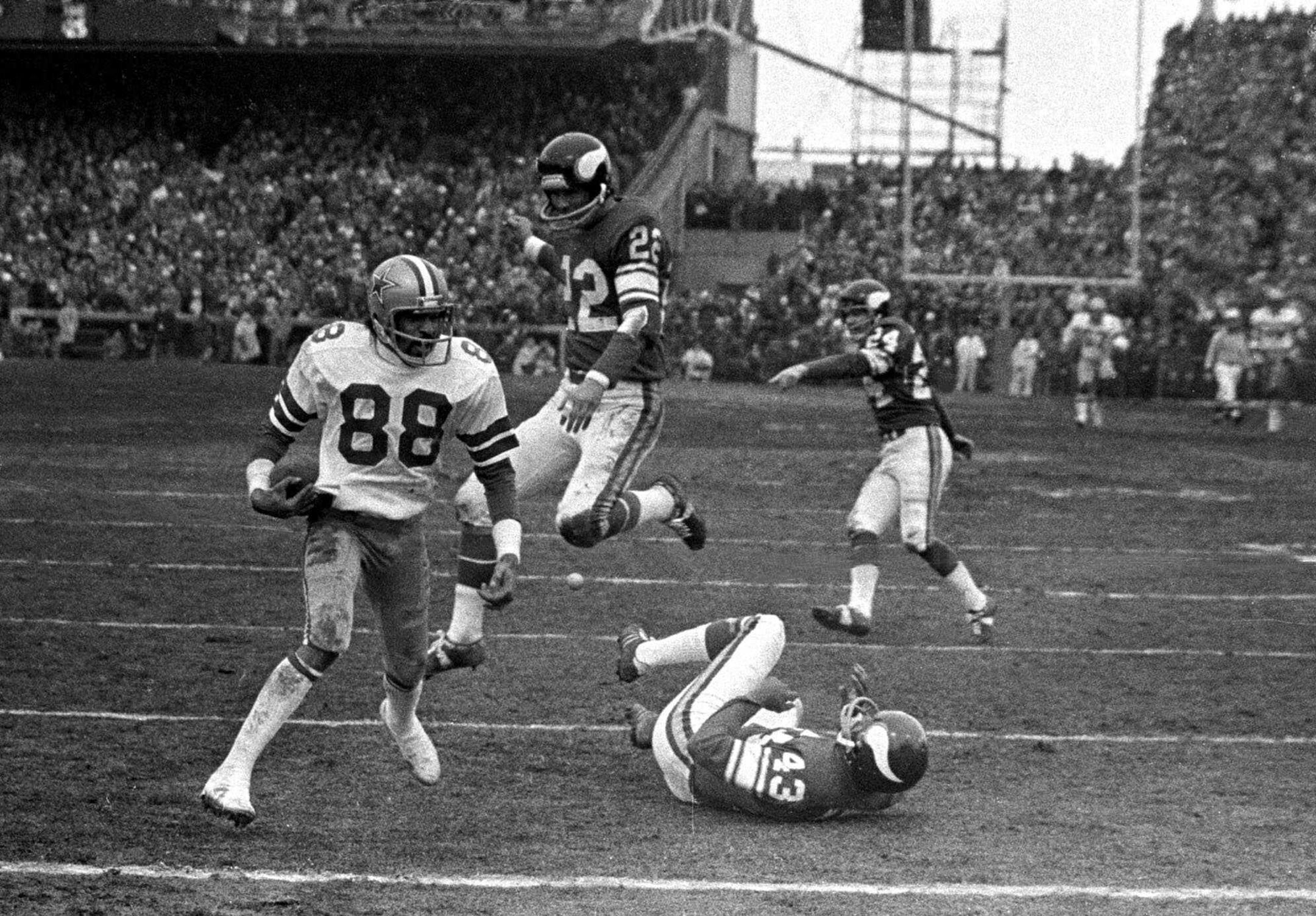 Dallas Cowboy wide receiver Drew Pearson (88) near the endzone Dec. 28,1975 on a game-winning 50-yard touchdown pass play in fourth quarter of NFC game at Bloominfton, Minn. Efforts to block Pearson by Vikings Nate Wright (43) and Paul Krause (22) were futile and Cowboys took the game.