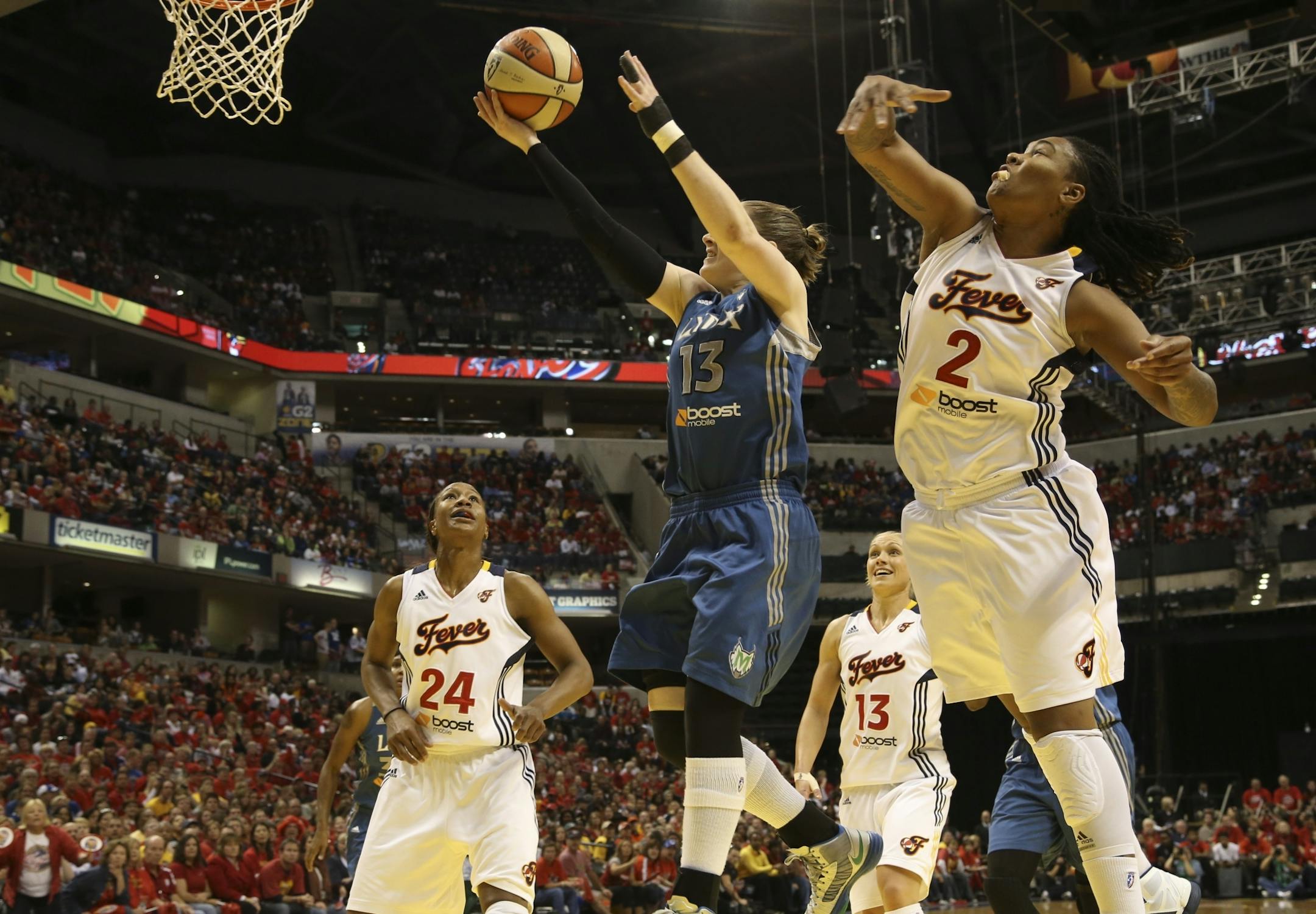 Minnesota Lynx�s Lindsay Whalen shoots around Indiana Fever�s Erlana Larkins during game 4 of the WNBA Finals at Bankers Life Fieldhouse in Indianapolis Ind., Sunday October 21, 2012.