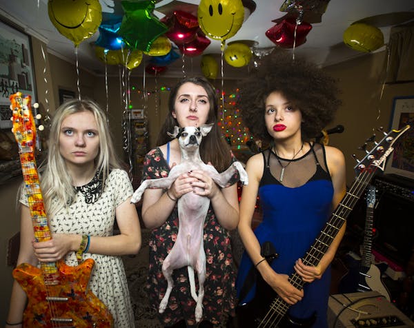 From left, Emily Schoonover, Danielle Cusack (with Schoonovers dog Eugene) and Bella Dawson of Bruise Violet, who play First Ave this weekend and next