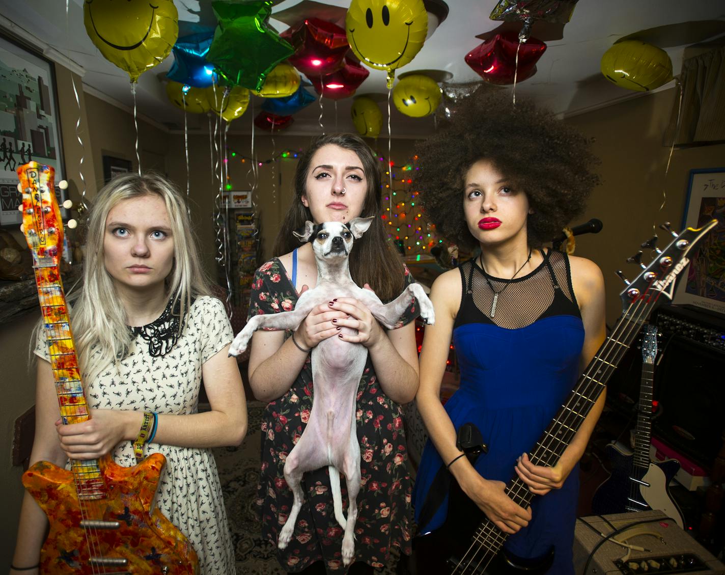 From left, Emily Schoonover, Danielle Cusack (with Schoonovers dog Eugene) and Bella Dawson of Bruise Violet, who play First Ave this weekend and next.