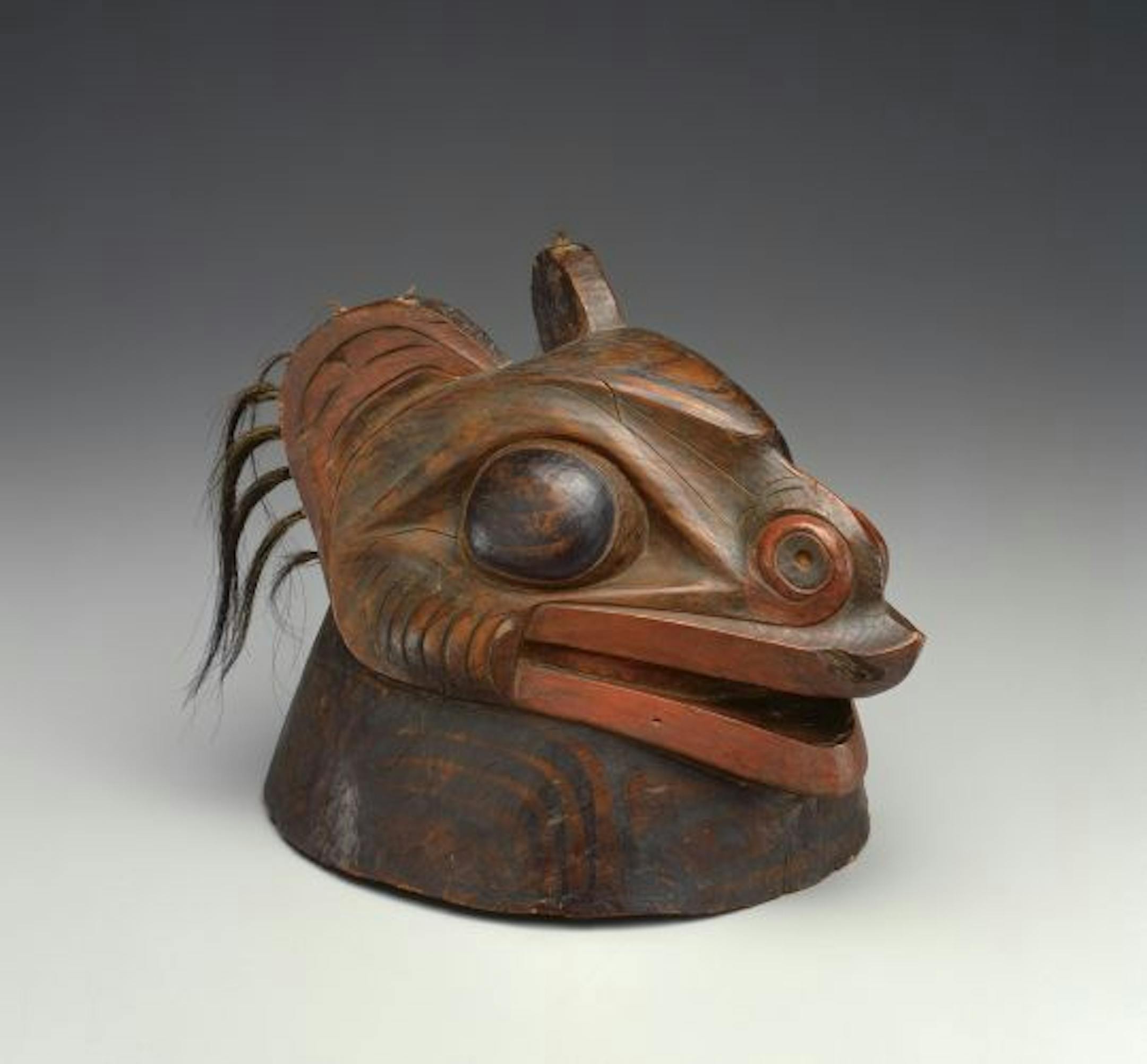 A war helmet (1780-1840) from the Tlingit in southeastern Alaska featured a carving to protect and inspire its wearer.