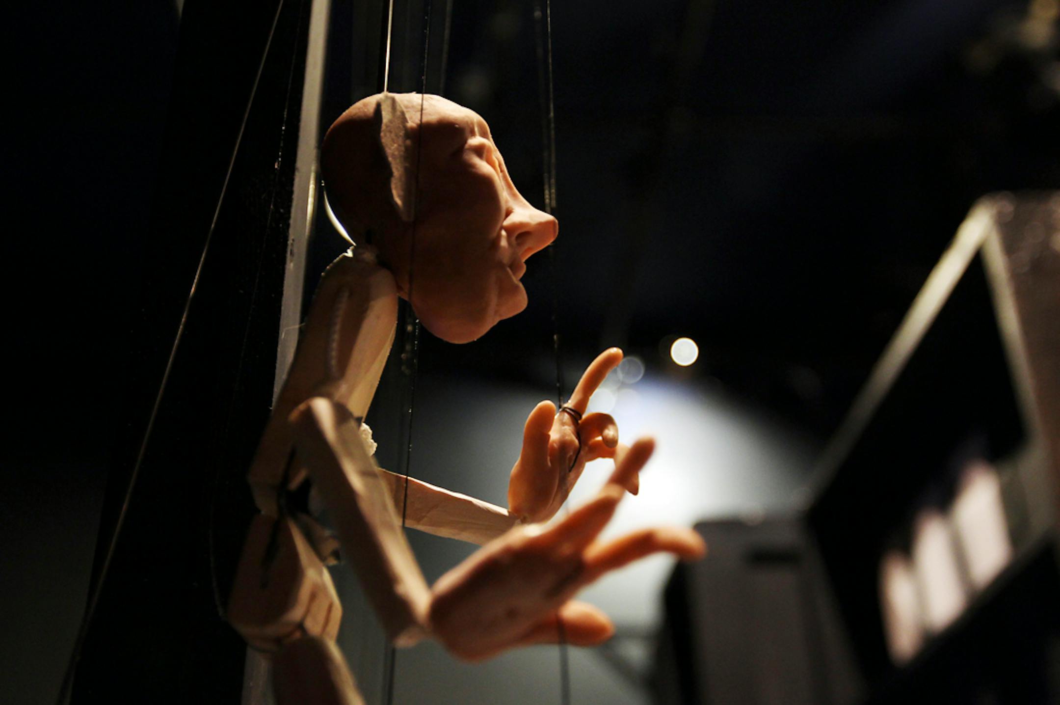 A puppet from "The Sorcerer's Apprentice" hangs backstage.