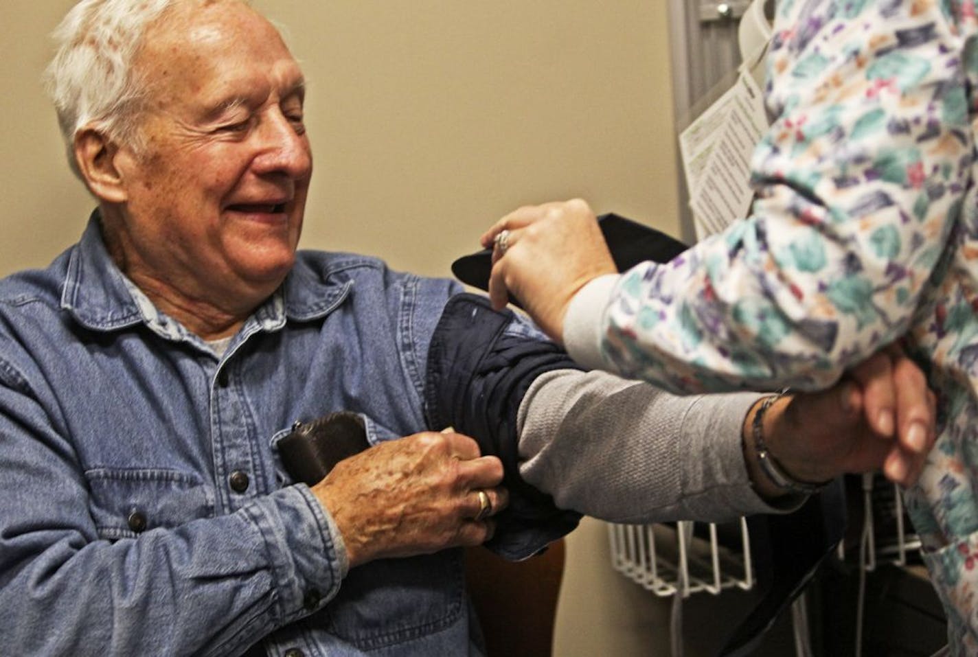 World War II Air Force veteran Charles Swanson, 87, of Brooklyn Center, had his vitals taken by LPN Judy Helgeson at the new VA Clinic in Ramsey Wednesday, Dec. 21, 2011. Though it was Swanson's first visit, he said: "I heard enough to want to transfer from St. Cloud."