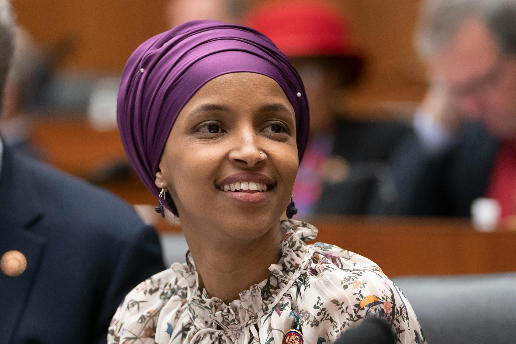 Rep. Ilhan Omar, D-Minn., sits with fellow Democrats on the House Education and Labor Committee during a bill markup, on Capitol Hill in Washington, Wednesday, March 6, 2019.