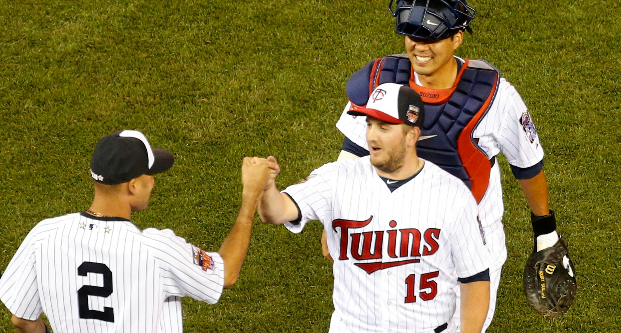 Glen Perkins (15) and Kurt Suzuki celebrated with Derek Jeter (2) at the end of the All-Star Game.