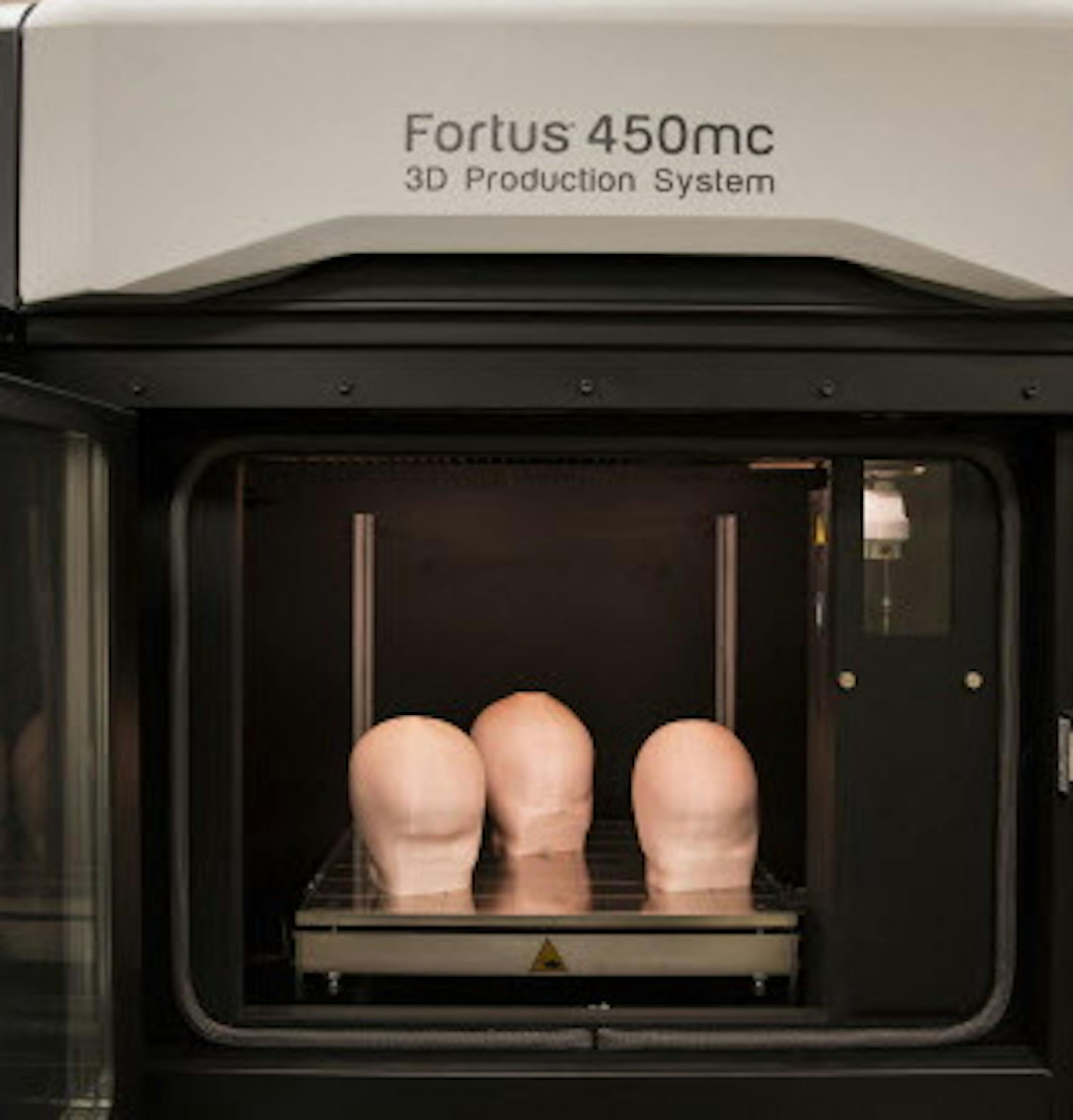 Head models of babies are 3D printed by a Stratasys 3D printer at Gillette Children's Specialty Healthcare's Assistive Technology lab in St. Paul on Monday, July 13, 2015. The models will then be used to make helmets for the babies to treat flat head syndrome. ] LEILA NAVIDI leila.navidi@startribune.com / BACKGROUND INFORMATION: Gillette Children's Speciality Healthcare is now using a Stratasys 3D printer to make molds for skull helmets to treat babies suffering from flat head syndrome.