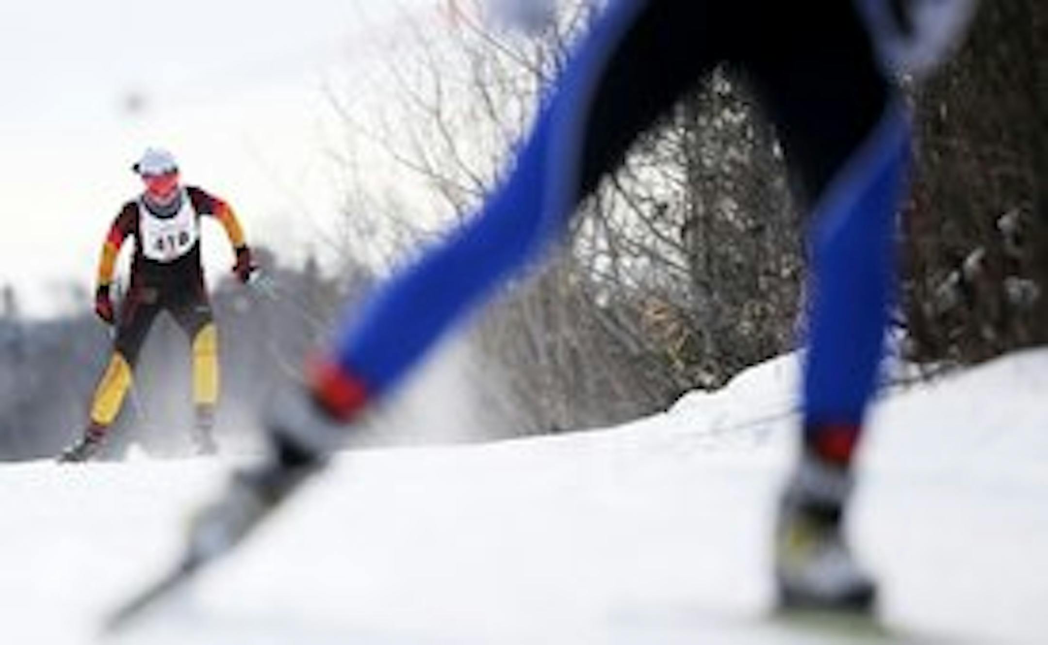 Girls' overall winner Margie Freed, left, of Eastview chased a skier during the freestyle event at the Nordic Skiing state meet Thursday at Giants Ridge in Biwabik.