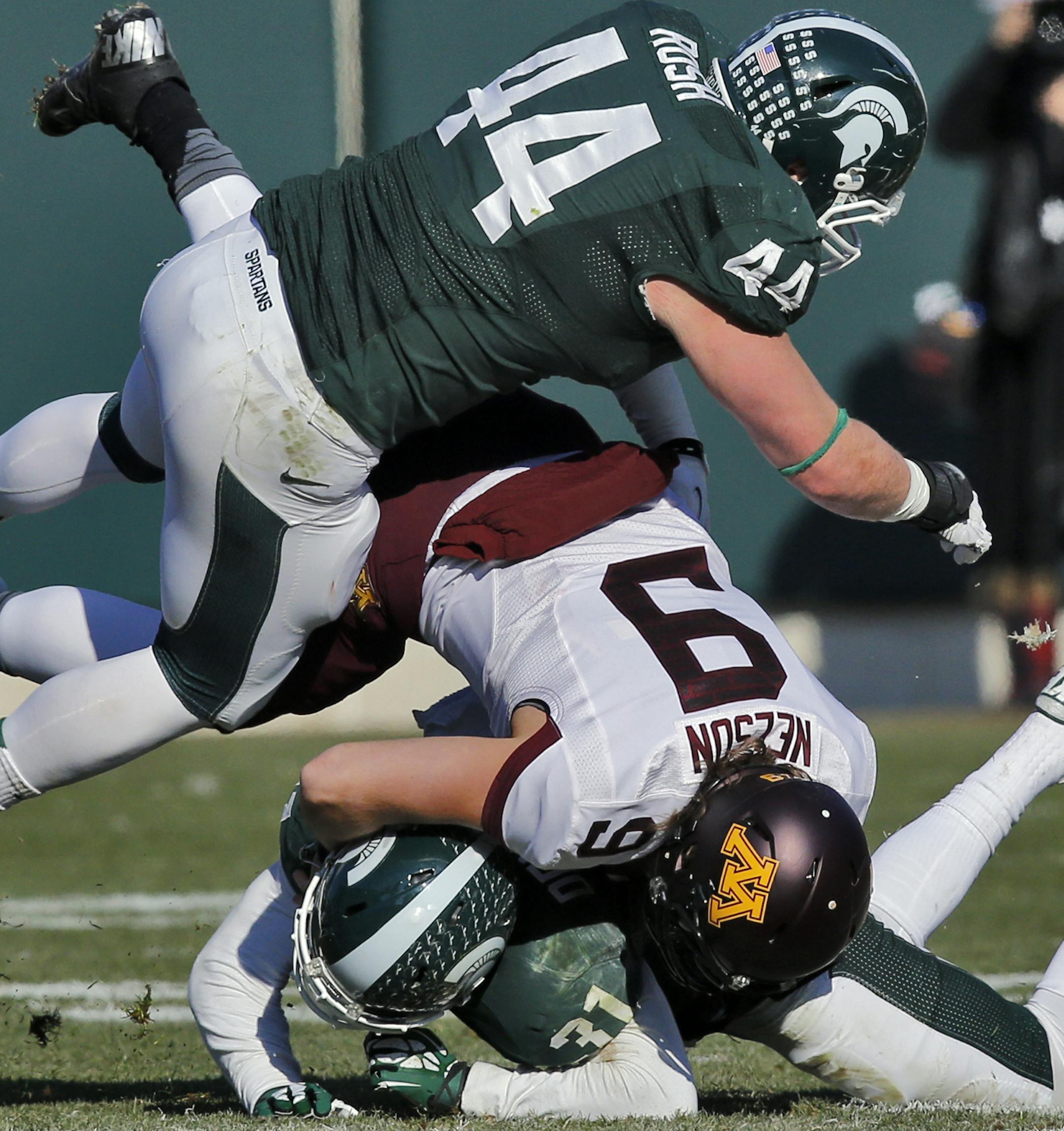 Minnesota Gophers vs. Michigan State Spartans. Michigan State won 14-3. Minnesota quarterback Philip Nelson (9) was not treated kindly by the Spartan defense enduring this sack. (MARLIN LEVISON/STARTRIBUNE(mlevison@startribune.com)