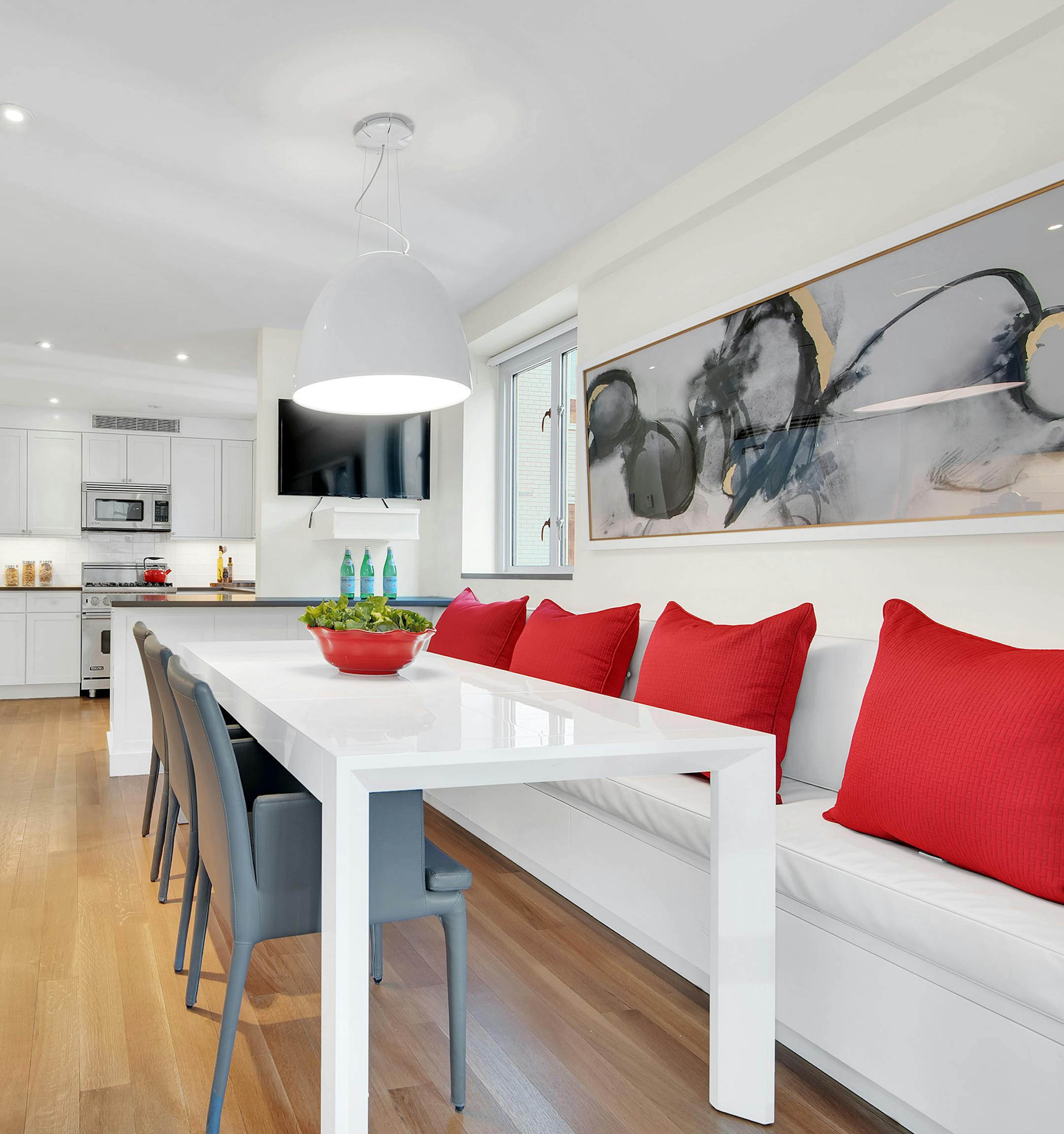Pops of red serve as the perfect spring accent in this oversized kitchen. (Design Recipes) ORG XMIT: 1226424