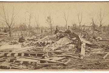 Three women viewed the debris left by the tornado that struck Rochester on the evening of Aug. 21, 1883.