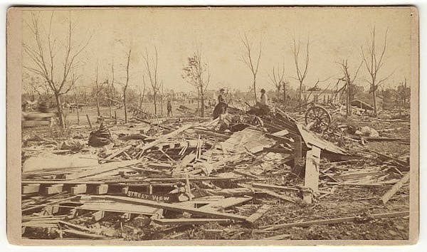 Three women viewed the debris left by the tornado that struck Rochester on the evening of Aug. 21, 1883.