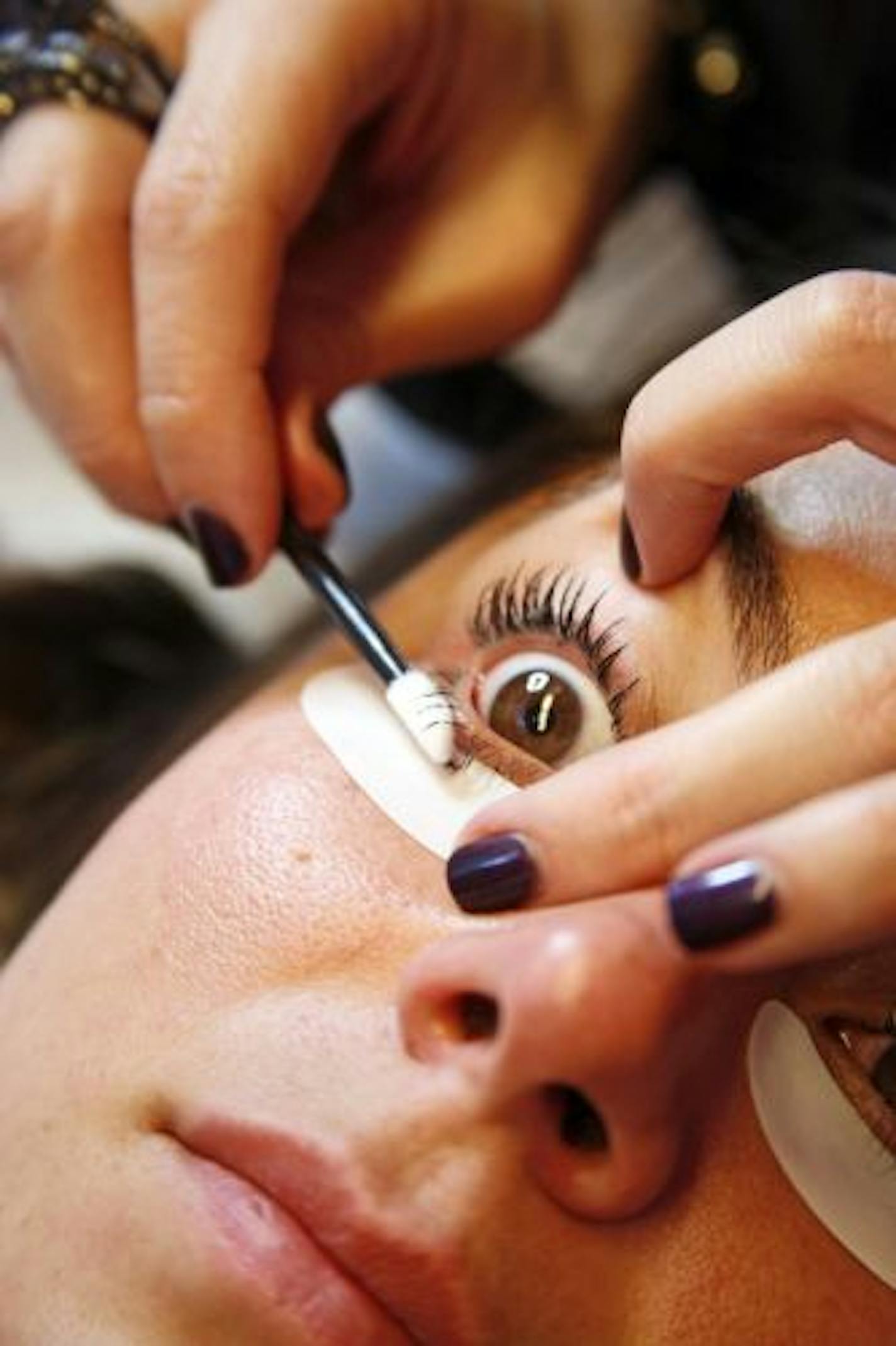 Courtney Akai applies the LashDip product to Amanda Smeal at the Courtney Akai Lash Boutique in New York on Dec. 20, 2010. LashDip, a semipermanent mascara that lasts for up to six weeks, is a gel made of black pigment, acetone and stearic acid that's painted onto the eye fringe.