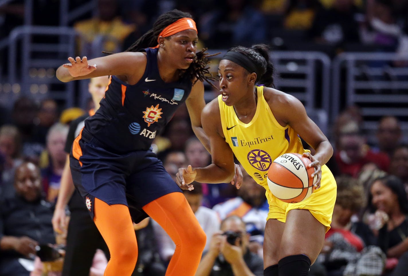 Los Angeles Sparks' Chiney Ogwumike, right, is defended by Connecticut Sun's Jonquel Jones during the first half of a WNBA basketball game Friday, May 31, 2019, in Los Angeles. (AP Photo/Marcio Jose Sanchez)