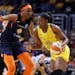 Los Angeles Sparks' Chiney Ogwumike, right, is defended by Connecticut Sun's Jonquel Jones during the first half of a WNBA basketball game Friday, May