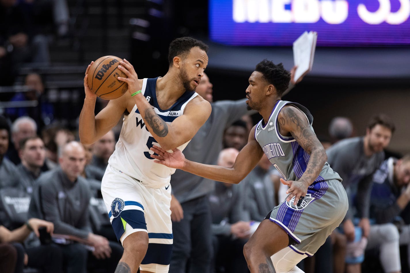 Minnesota Timberwolves forward Kyle Anderson (5) is defended by Sacramento Kings guard Malik Monk during the second half of an NBA basketball game in Sacramento, Calif., Saturday, March 4, 2023. The Timberwolves won 138-134. (AP Photo/José Luis Villegas)