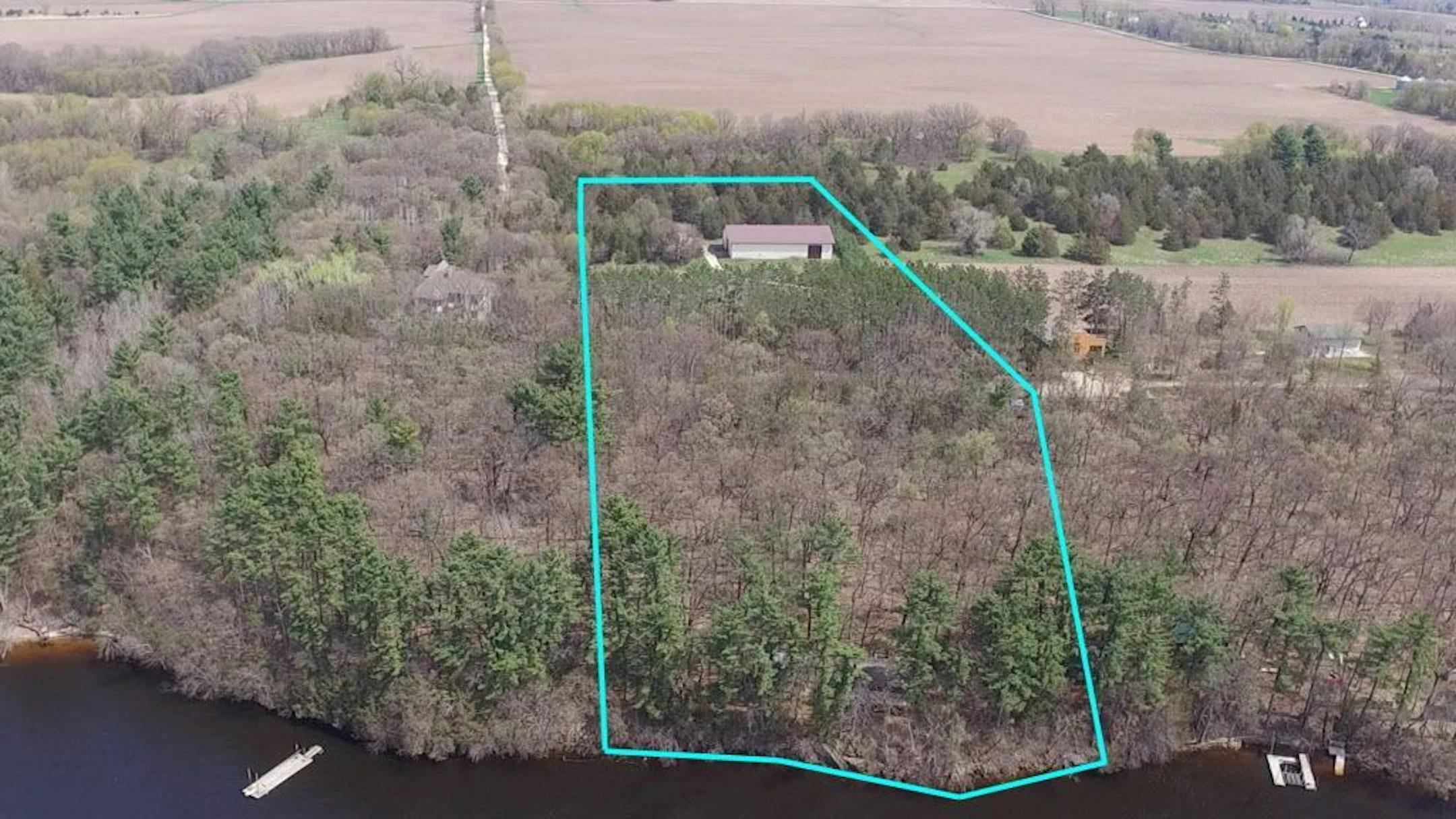 An overhead view shows the 5.9 acre site on the river.