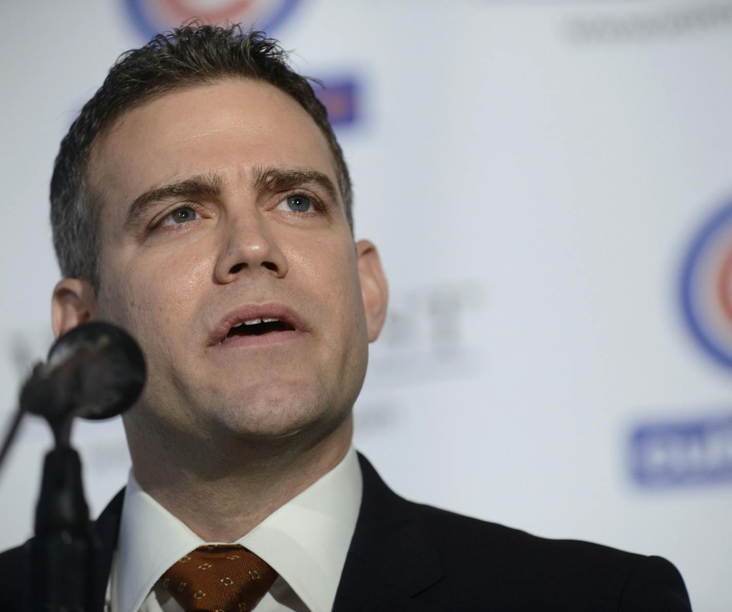 President of Baseball Operations Theo Epstein speaks to the media as he introduces Pitcher Jon Lester as a member of the Chicago Cubs during a press conference in Chicago, Monday, Dec. 15, 2014. Lester agreed to a $155 million, six-year contract with the Cubs at the winter meetings last week that set baseball records for largest signing bonus and biggest upfront payment. (AP Photo/Paul Beaty) ORG XMIT: ILPB113