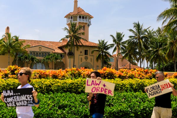 People protested outside former President Donald Trump’s Mar-a-Lago residence in Palm Beach, Fla, earlier this month.