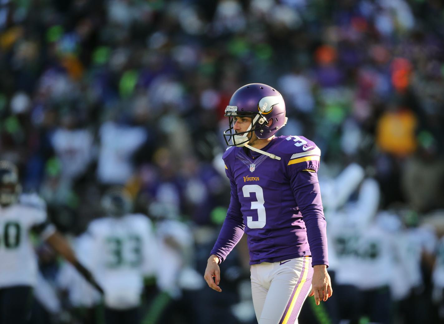 Vikings kicker Blair Walsh walked away after his chance for a game winning 27 yard field goal sailed wide left at the end of the fourth quarter and the Seattle players began celebrating.