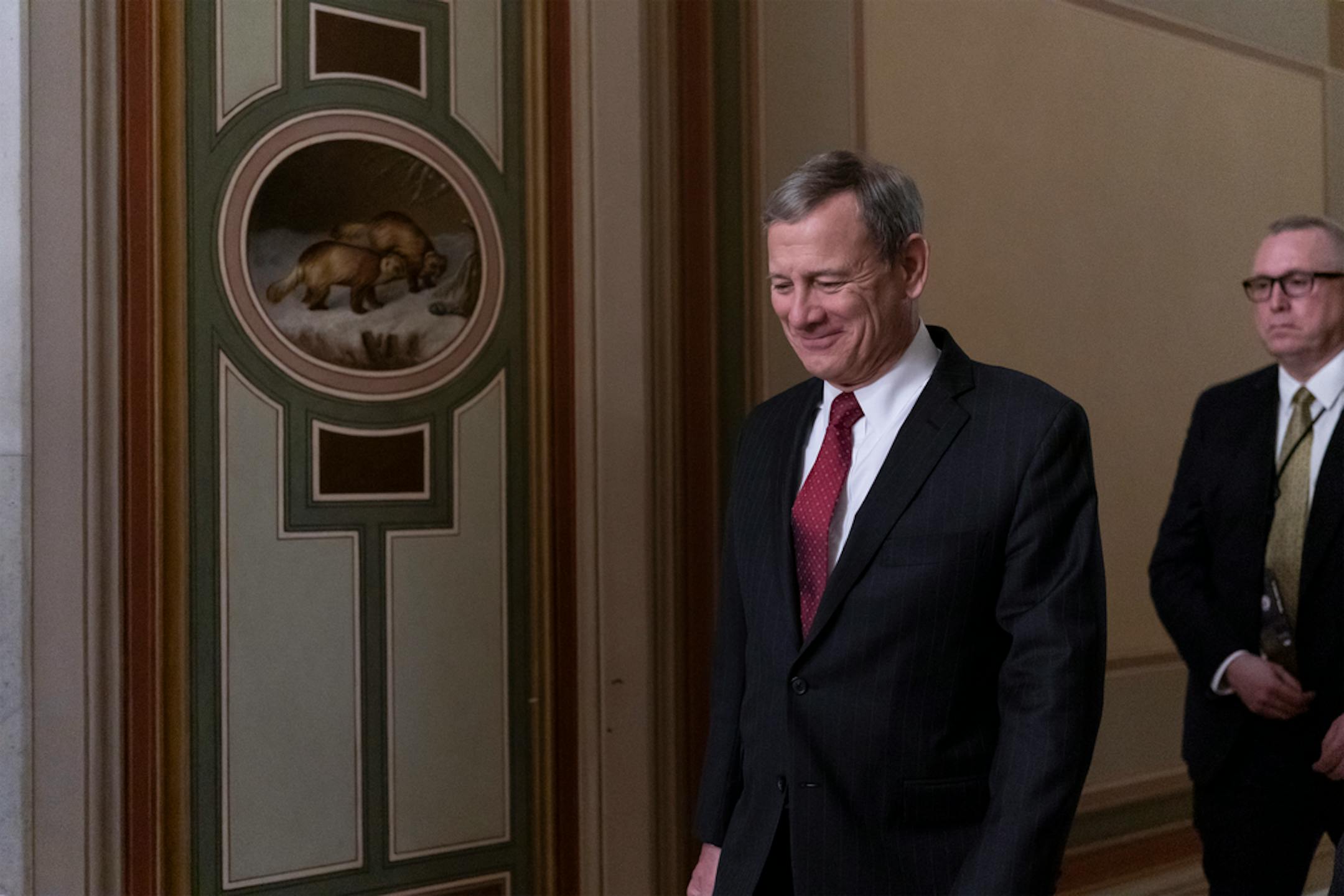 Chief Justice of the United States John Roberts departs the Capitol as the Senate finishes its work for the day in the impeachment trial of President Donald Trump on charges of abuse of power and obstruction of Congress, in Washington, Friday, Jan. 24, 2020. (AP Photo/J. Scott Applewhite)