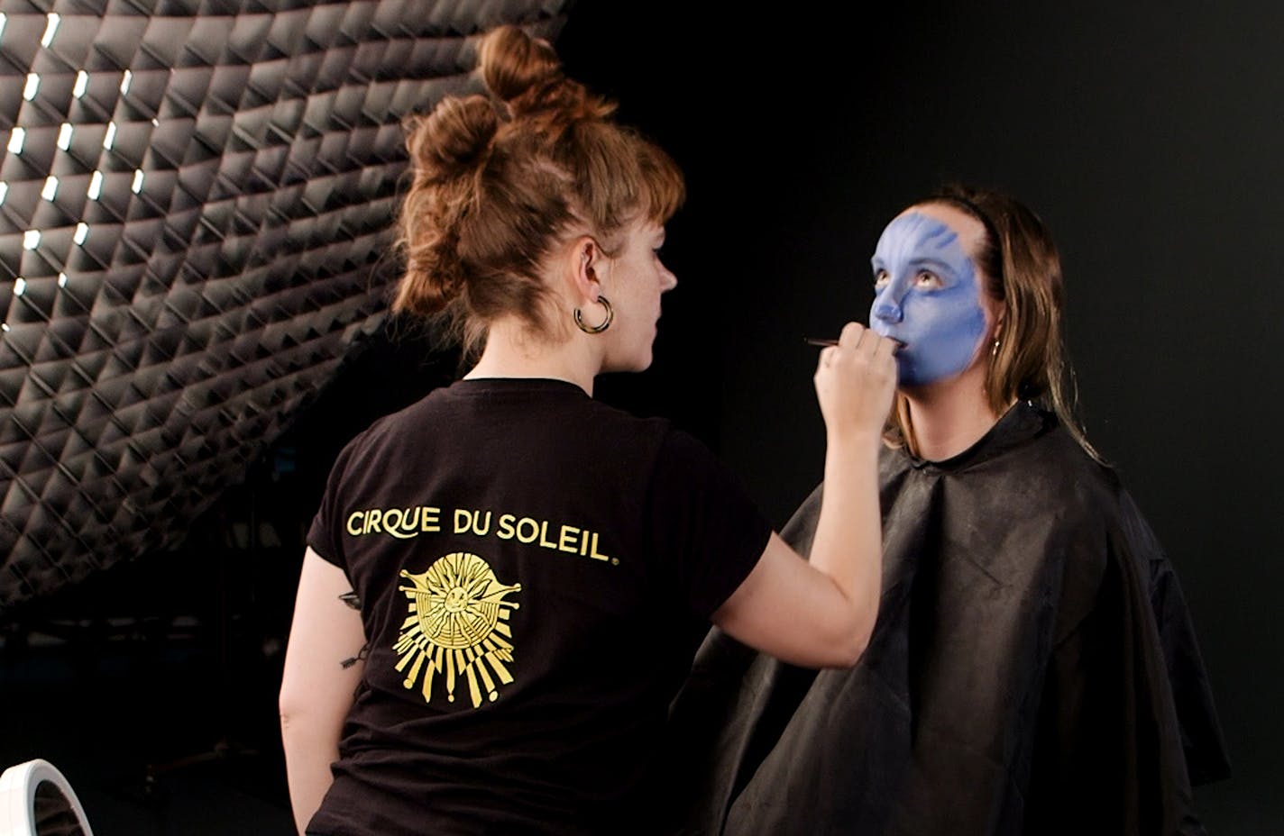 Cirque wardrobe assistant and Twin Cities native Ali Schwalbe transform Star Tribune intern Mary Kate Metivier into Na'vi from "Avatar."