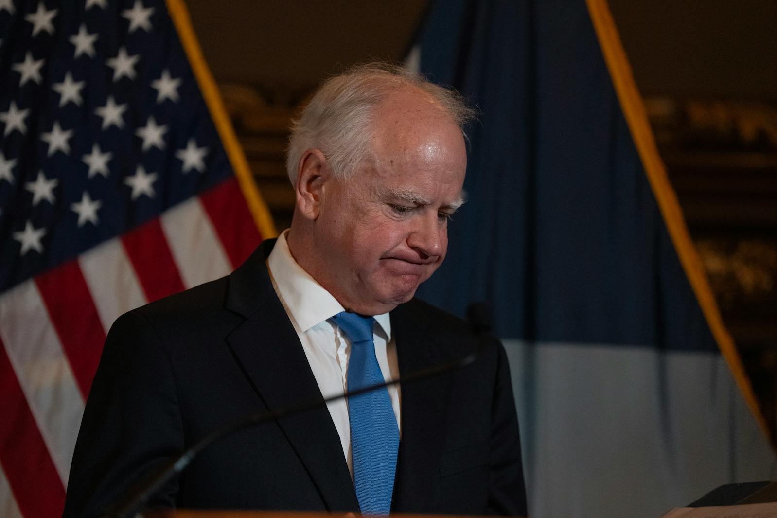 Gov. Tim Walz speaks during a press conference on Monday annoying he'll be withdrawing from the 2026 gubernatorial race. 
