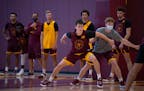 Walk-on Will Ramberg competes in a drill with a student manager in Gophers practice.