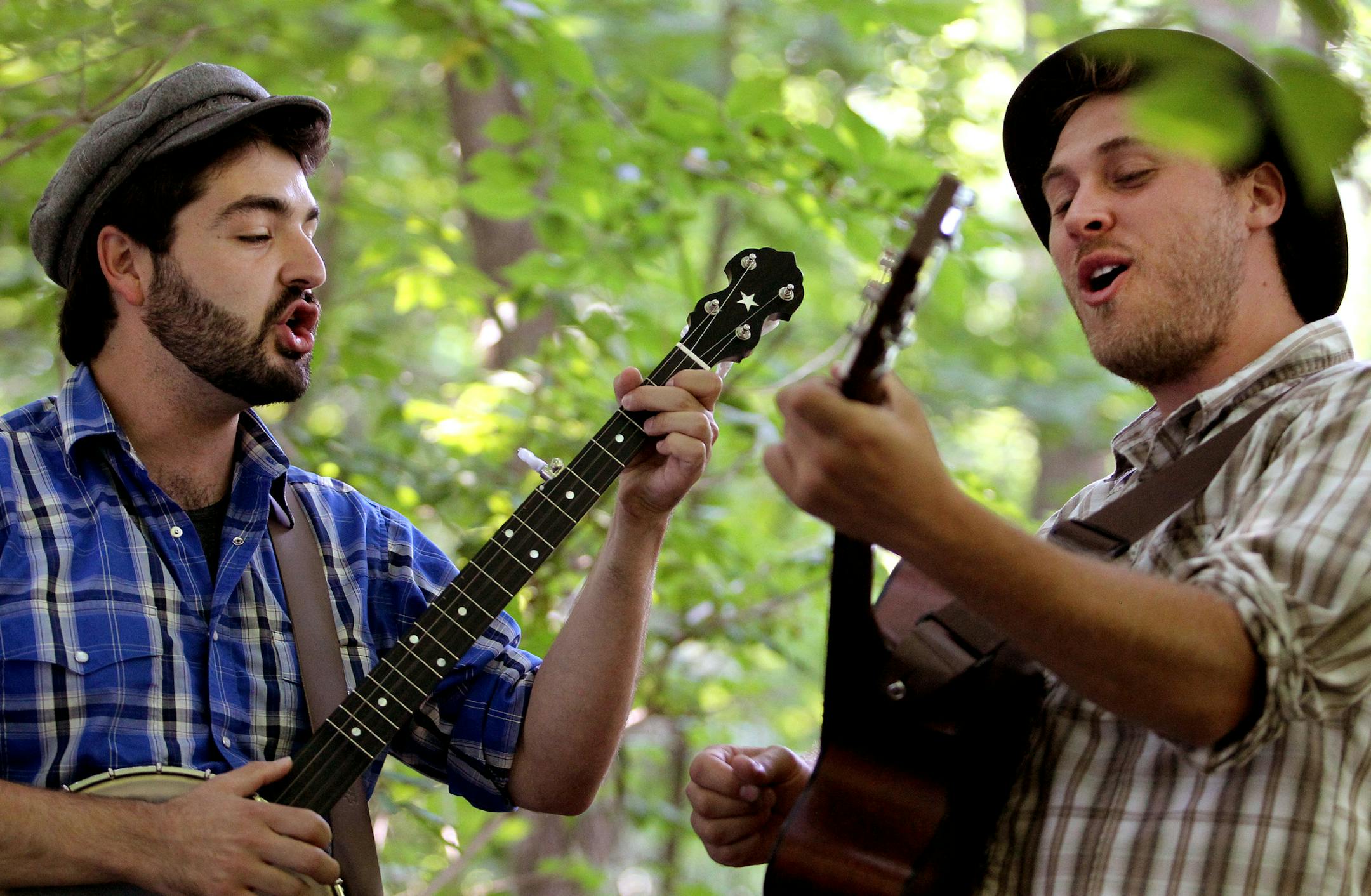 The Okee Dokee Brothers, Justin Lansing, left, and Joe Mailander, pose for a portrait at Theodore Wirth Park in Minneapolis, Minn., on Monday, August 19, 2013. ] (ANNA REED/STAR TRIBUNE) anna.reed@startribune.com (cq)
